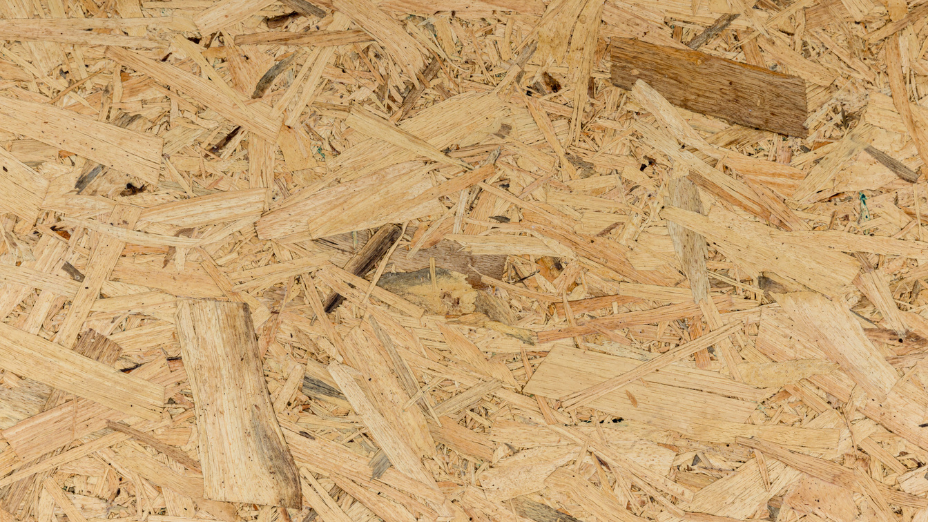OSB wood (Oriented strand board) background. OSB texture. Chipboard sheet. Plywood texture and background